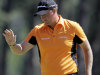 Peter Hanson, of Sweden, waves after his birdie on the eighth green during the third round of the Masters golf tournament Saturday, April 7, 2012, in Augusta, Ga. (AP Photo/Darron Cummings)