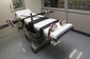 In this Thursday, Oct. 9, 2014 photo, the gurney in the the execution chamber at the Oklahoma State Penitentiary is pictured in McAlester, Okla. Oklahoma plans to resume executions Thursday, Jan. 15, 2015, after botching its last one and will use the same three-drug method as a Florida lethal injection scheduled for the same day. (AP Photo/Sue Ogrocki, File)