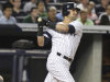 New York Yankees' Nick Swisher looks after his grand slam during the third inning of the baseball game against the Texas Rangers Monday, Aug. 13, 2012 at Yankee Stadium in New York.  (AP Photo/Seth Wenig)
