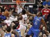 Portland Trail Blazers' Hickson shoots as Oklahoma City Thunder's Durant defends, during their NBA basketball game in Portland