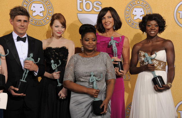 Castmembers of "The Help" pose backstage with their awards for outstanding performance by a cast in a motion picture at the 18th Annual Screen Actors Guild Awards on Sunday Jan. 29, 2012 in Los Angeles. From left, Chris Lowell, Emma Stone, Octavia Spencer, Allison Janney and Viola Davis(AP Photo/Chris Pizzello)
