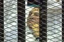 FILE - This Aug. 3, 2011 image made from video by Egyptian State Television shows Hosni Mubarak, 83, lying on a hospital bed inside a cage of mesh and iron bars in a Cairo courtroom as his historic trial begins on charges of corruption and complicity in the killing of protesters during the uprising that ousted him. Guilty or not, Saturday's verdict in the Hosni Mubarak trial may only add to Egypt's polarization. The country is bracing for a heated runoff for president pitting the ousted leader's protege and last prime minister against an Islamist from a group that the old regime repeatedly cracked down.(AP Photo/Egyptian State TV, File)