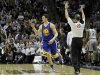 Golden State Warriors guard Klay Thompson reacts after hitting a three-point shot against the San Antonio Spurs during their NBA basketball game in San Antonio, Texas