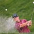 Steve Wheatcroft of the U.S. hits out of the sand trap during the Canadian Open Golf tournament in Toronto