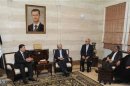 Syria's Prime Minister Wael al-Halqi meets Iran's Supreme National Security Council Secretary Saeed Jalili in Damascus