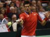 Serbia's Novak Djokovic hits a return to Sam Querrey of the U.S. during their Davis Cup singles quarter-final match in Boise