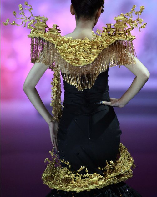 A model walks down the catwalk during the Mao Gepin make-up styling show at the China Fashion Week in Beijing, China, Tuesday, Nov. 1, 2011. (AP Photo/Ng Han Guan)