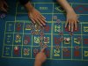 In this Oct. 25, 2012 photo, a gambling school students take practice on a table in Macau, China. Hordes of Chinese high rollers flooding into Macau have turned the city into an Asian casino boomtown but they’re also posing a challenge for China’s next generation of leaders.(AP Photo/Vincent Yu)