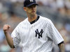 New York Yankees pitcher A.J. Burnett reacts during the seventh inning of the first game of a baseball doubleheader against the Boston Red Sox, Sunday, Sept. 25, 2011, at Yankee Stadium in New York. Burnett got the win as the Yankees defeated the Red Sox 6-2. (AP Photo/Bill Kostroun)