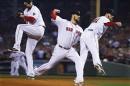 In a multiple exposure, Boston Red Sox starting pitcher John Lackey throws during the first inning of Game 6 of baseball's World Series against the St. Louis Cardinals Wednesday, Oct. 30, 2013, in Boston. (AP Photo/Matt Slocum)