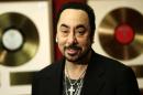 FILE - In this Wednesday, Nov. 21, 2007 file photo, U.S. music producer David Gest poses with some of his collection of entertainment memorabilia at an auction house in London. Music producer David Gest, ex-husband of Liza Minnelli, died Tuesday, April 12, 2016 at 62. (AP Photo/Sang Tan, file)