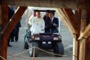 Pope Francis (L) sits in a golf cart with King Abdullah II of Jordan (R) as they visit Bethany, a site on the eastern bank of the River Jordan where some Christians believe Jesus was baptised, on May 24, 2014