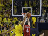 Michigan guard Trey Burke (3) blocks a shot attempt by Ohio State guard Aaron Craft (4) during the overtime period of an NCAA college basketball game at the Crisler Center in Ann Arbor, Mich., Tuesday, Feb. 5, 2013. Michigan defeated Ohio State 76-74. (AP Photo/Carlos Osorio)