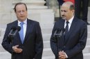 French President Francois Hollande and Ahmad Jarba, head of the opposition Syrian National Coalition, speak to journalists at the Elysee Palace in Paris