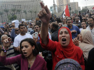 Egyptian protesters opposed to president Mohammed Morsi chant slogans in Tahrir Square in Cairo, Egypt, Friday, Nov. 23, 2012. Opponents and supporters of Mohammed Morsi clashed across Egypt on Friday, the day after the president granted himself sweeping new   powers that critics fear can allow him to be a virtual dictator.(AP Photo/Mohammed Asad)
