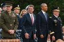 (L-R) Incoming Chairman of the Joint Chiefs of Staff, Marine Corps Gen. Joseph Dunford; Secretary of Defense Ash Carter, President Obama and outgoing Chairman of the Joint Chiefs of Staff Gen. Martin Dempsey stand during a retirement ceremony at Fort Myer, Virginia on September 25, 2015
