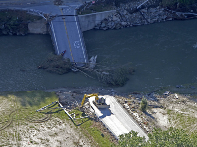 A bridge on Route 73 lies in the river in this aerial view on Tuesday, Aug. 30, 2011 in Rochester, Vt. All access to the town has been cut off.  National Guard helicopters rushed food and water Tuesda