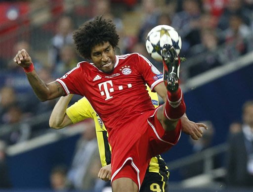 Bayern's Dante of Brazil controls the ball during the Champions League Final soccer match between  Borussia Dortmund and Bayern Munich at Wembley Stadium in London, Saturday May 25, 2013