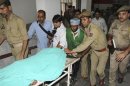 Police and hospital staff shift Sanaullah Haq, a Pakistani prisoner, to an intensive care ward in a hospital in Jammu