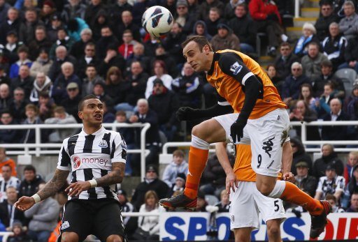 Fulham's Berbatov attempts a header at the Newcastle United goal during their English Premier League soccer match in Newcastle, England