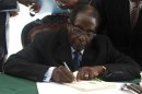 Zimbabwe President Robert Mugabe signs Zimbabwe's new constitution into law in the capital Harare