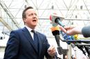 British Prime Minister David Cameron speaks to journalists as he arrives at the European Union Council building in Brussels, on March 6, 2014
