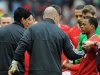 Manchester United's Patrice Evra (R) and Liverpool's Luis Suarez (L) fail to shake hands before their match on Saturday