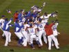 The Dominican Republic players celebrate after beating Puerto Rico in the championship game of the World Baseball Classic in San Francisco, Tuesday, March 19, 2013. The Dominican Republic won 3-0. (AP Photo/Jeff Chiu)