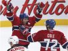 ontreal Canadiens' Andrei Markov celebrates his game-winning goal with teammate Erik Cole during overtime NHL hockey action against New Jersey Devils in Montreal