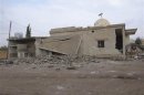 A view of a damaged mosque is seen after Syrian Air Force fighter jets loyal to Syria's President Bashar al-Assad fired missiles at the town of Ras al-Ain