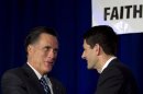 Republican presidential candidate, former Massachusetts Gov. Mitt Romney, left, greets U.S. Rep. Paul Ryan, R-Wis., Chairman of the House Budget Committee, right, on stage at a meeting of the Wisconsin Faith & Freedom Coalition during a campaign stop in Pewaukee, Wis., Saturday, March 31, 2012. (AP Photo/Steven Senne)