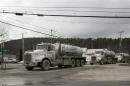 A line of trucks carrying water to Natural gas rigs in Monroeton Pennsylvania
