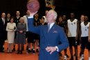 Britain's Prince Charles, the Prince of Wales, lines up a free throw while visiting basketball practice at the Fryshuset Youth centre in Stockholm on Thursday March 22, 2012. (AP Photo/Pontus Lundahl) SWEDEN OUT