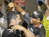New York Yankees' Jorge Posada, left, celebrates with Mariano Rivera, right, after the Yankees clinched the AL East title with a 4-2 win over the Tampa Bay Rays in the second game of a baseball doubleheader Wednesday, Sept. 21, 2011, in New York. (AP Photo/Frank Franklin II)