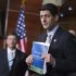 House Budget Chairman Rep. Paul Ryan, R-Wis., right, with Republican Conference Chairman Rep. Jeb Hensarling, R-Texas, left, holds a copy of their budget proposal during a news conference on Capitol Hill in Washington, Thursday, March 29, 2012.  (AP Photo/Manuel Balce Ceneta)
