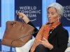 International Monetary Fund, IMF, managing director Christine Lagarde shows her bag as she speaks during a session at the World Economic Forum in Davos, Switzerland, Saturday, Jan. 28, 2012.   (AP Photo/Michel Euler)
