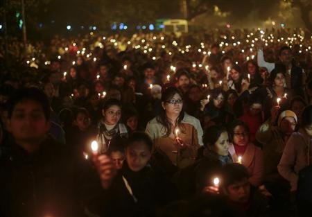 REFILE - REMOVING EXTRANEOUS THIRD SENTENCE Demonstrators hold candles during a candlelight vigil for a gang rape victim who was assaulted in New Delhi December 29, 2012. A woman whose gang rape provoked protests and a rare national debate about violence against women in India died from her injuries on Saturday, prompting promises of action from government that has struggled to respond to public outrage. REUTERS/Danish Siddiqui
