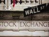 A street sign for Wall Street hangs in front of the New York Stock Exchange