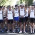 Members of the University of Wyoming cross country team gather their thoughts during a moment of silence on Saturday,  Sept. 10, 2011  at the annual Always A Cowboy 8K run and 5K walk In Laramie, Wyo.  (AP Photo/Laramie Boomerang, Andy Carpenean)