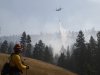 Summers watches a water drop as crews continue to battle the Taylor Bridge Fire near Cle Elum
