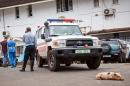 A baby pig sleeps in front of an ambulance used at the Connaught Hospital as part of their Ebola virus fleet, during a three-day lockdown to prevent the spread on the Ebola virus in Freetown, Sierra Leone, Sunday, Sept. 21, 2014. Volunteers going door to door during a three-day lockdown intended to combat Ebola in Sierra Leone say some residents are growing increasingly frustrated and complaining about food shortages. (AP Photo/ Michael Duff)