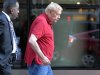 Los Angeles Lakers owner Jerry Buss leaves following NBA labor meetings in New York