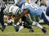 New York Jets quarterback Mark Sanchez (6) is brought down by Tennessee Titans defensive end Kamerion Wimbley (95) in the second quarter of an NFL football game, Monday, Dec. 17, 2012, in Nashville, Tenn. The Titans won 14-10. (AP Photo/Joe Howell)