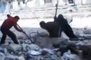 This image made from amateur video and released by the Syria media center Friday, March 23, 2012, purports to show Syrians pulling out the body of a man under the rubble of a building that was bombed in Homs, Syria. Syrian President Bashar Assad says he will spare no effort to make the mission of U.N.-Arab League envoy Kofi Annan a success but he demands that armed opponents commit to halting violence. (AP Photo/Syria Media Center via APTN) THE ASSOCIATED PRESS CANNOT INDEPENDENTLY VERIFY THE CONTENT, DATE, LOCATION OR AUTHENTICITY OF THIS MATERIAL. TV OUT