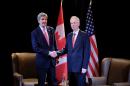 Canadian Foreign Minister Stephane Dion (R) and US Secretary of State John Kerry attend the North American Foreign Ministers Meeting on January 29, 2016 in Quebec City