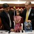 Guinness World Records adjudicator Rob Molloy, right, and Dr. Manoj Pahukar of Wockhardt hospital, second left, measure Jyoti Amge at a press conference in Nagpur, India, Friday, Dec. 16, 2011. Amge, 18, was declared shortest woman in the world measuring 62.8 centimeters (24.7 inches) by the Guinness World Records. (AP Photo/Manish Swarup)