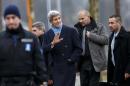 U.S. Secretary of State John Kerry, center, returns to his hotel after walking on the bank of Lake Geneva, following a bilateral meeting with Iranian Foreign Minister Mohammad Javad Zarif for a new round of nuclear talks in Geneva, Switzerland, Monday, Feb. 23, 2015. (AP Photo/Keystone, Salvatore Di Nolfi)