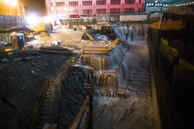 Sea water floods the Ground Zero construction site, Monday, Oct. 29, 2012, in New York. Sandy continued on its path Monday, as the storm forced the shutdown of mass transit, schools and financial markets, sending coastal residents fleeing, and threatening a dangerous mix of high winds and soaking rain.  (AP Photo/ John Minchillo)