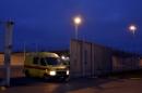 An ambulence leaves a prison in Bruges where Salah Abdeslam is being held, Belgium
