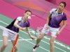 South Korea's Jung Kyung-eun and Kim Ha-na play against China during their women's doubles badminton match during the London 2012 Olympic Games at the Wembley Arena